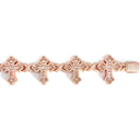 Rose gold bracelet with intricate design on a white background