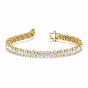 Gold bracelet with clear gemstones on a white background