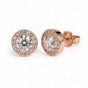 Rose gold earrings with clear gemstones on a white background